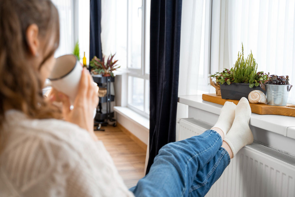 woman with feet on radiator