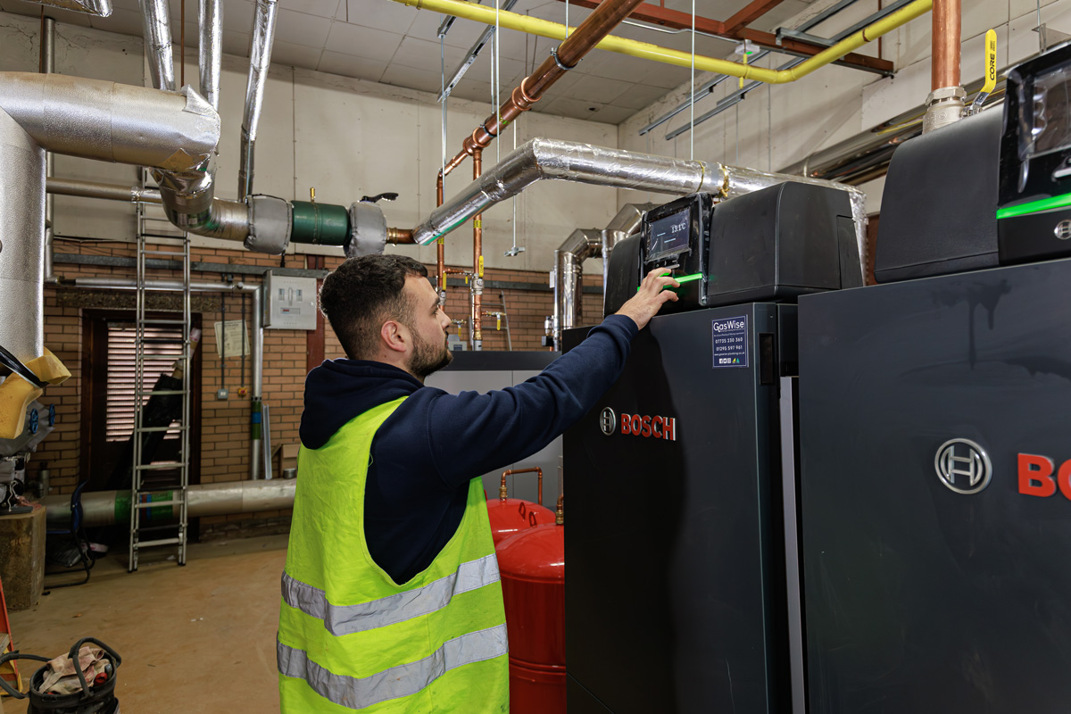 boiler engineer looking at boiler